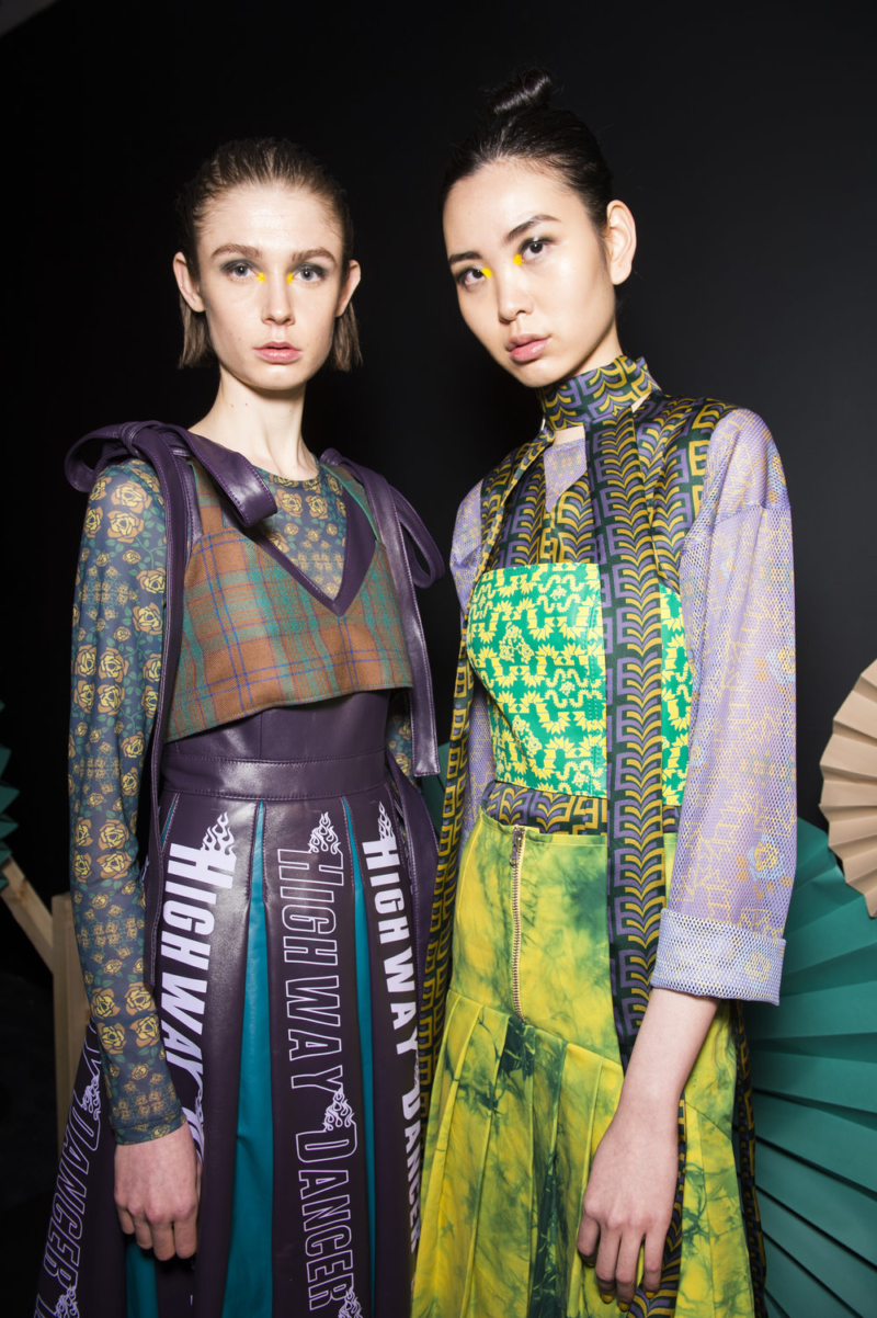 Katie Ann McGuigan AW19 runway picture of two models wearing vibrant prints.